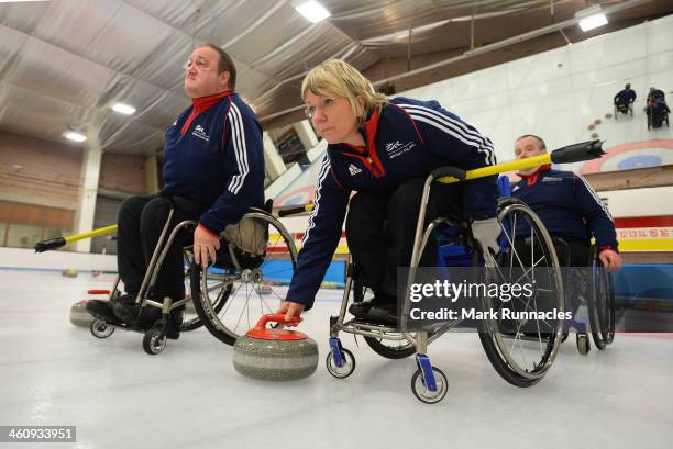 Angela Malone watched by Tom Killin , in action during the ParalympicsGB Wheelchair Curling Training Day on 6th January 2014 in Hamilton, Scotland.