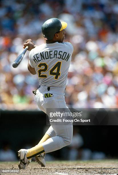 Outfielder Rickey Henderson of the Oakland Athletics bats against the Baltimore Orioles during an Major League Baseball game circa 1991 at Memorial...