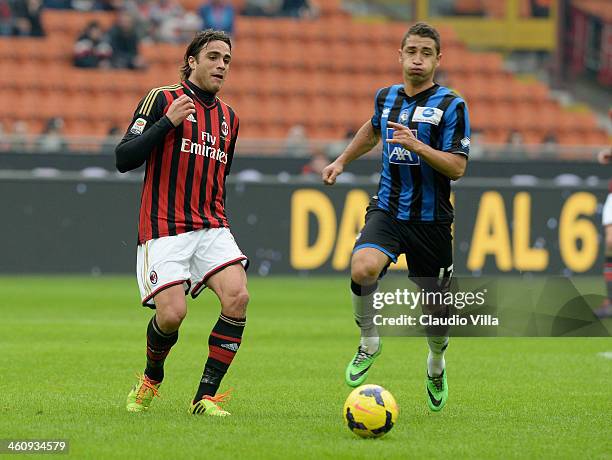 Alessandro Matri of AC Milan and Carlos Carmona of Atalanta BC compete for the ball during the Serie A match between AC Milan and Atalanta BC at San...
