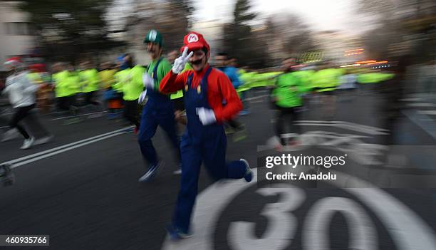 People wearing fancy costumes attend the 50th San Silvestre Vallecana, annual 10 km road race, in Madrid, Spain on December 31, 2014. San Silvestre...