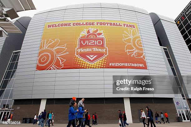 Fans make their way into the stadium before the start of the Vizio Fiesta Bowl between the Arizona Wildcats and Boise State Broncos at University of...