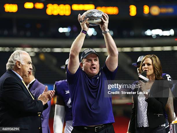 Head coach Gary Patterson of the TCU Horned Frogs celebrates with the trophy after their 42 to 3 win over the Ole Miss Rebels during the Chik-fil-A...