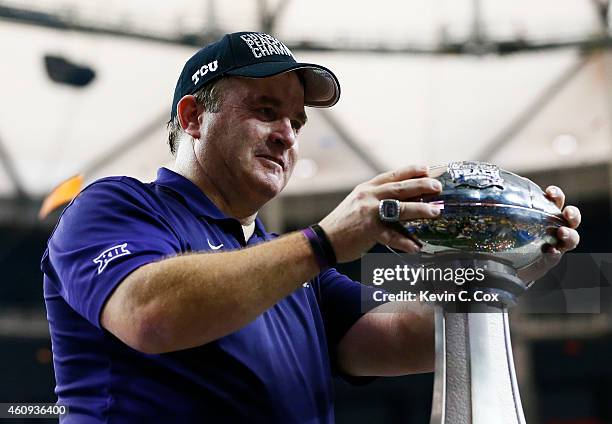 Head coach Gary Patterson of the TCU Horned Frogs celebrates with the trophy after their 42 to 3 win over the Ole Miss Rebels during the Chik-fil-A...