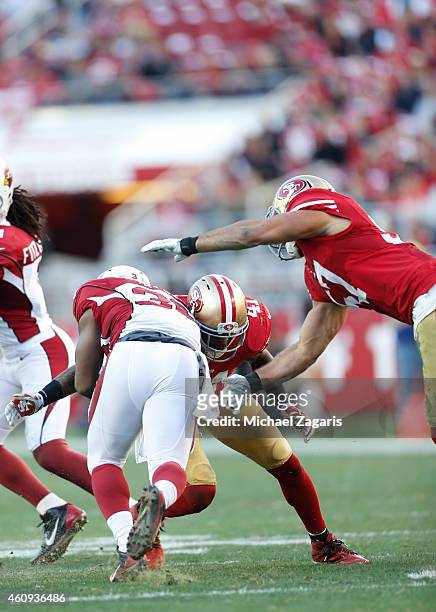 Antoine Bethea and Michael Wilhoite of the San Francisco 49ers tackle Stepfan Taylor of the Arizona Cardinals during the game at Levi Stadium on...