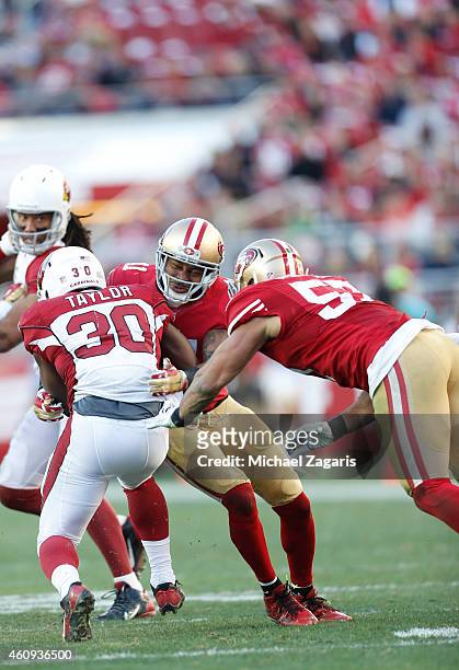 Antoine Bethea and Michael Wilhoite of the San Francisco 49ers tackle Stepfan Taylor of the Arizona Cardinals during the game at Levi Stadium on...