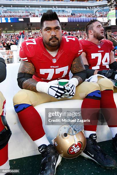 Mike Iupati of the San Francisco 49ers sits on the bench during the game against the Arizona Cardinals at Levi Stadium on December 28, 2014 in Santa...