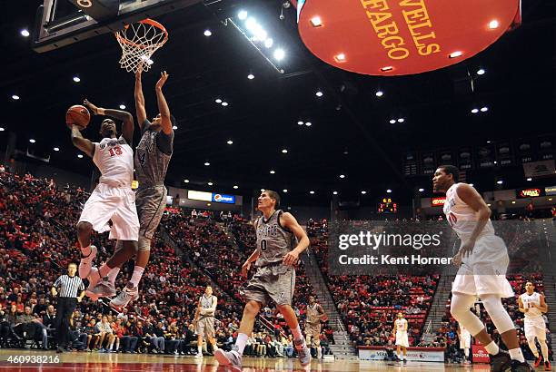 Winston Shepard of the San Diego State Aztecs shoots the ball in the first half of the game against Kamryn Williams of the Air Force Falons at Viejas...