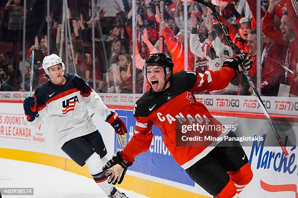 Max Domi of Team Canada scores an empty net goal to secure Team Canada's win over Team United States in a preliminary round game during the 2015 IIHF...
