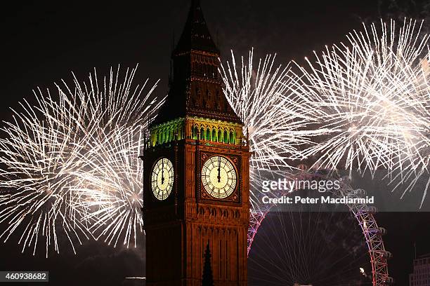 Fireworks light up the London skyline and Big Ben just after midnight on January 1, 2015 in London, England. For the first time thousands of people...