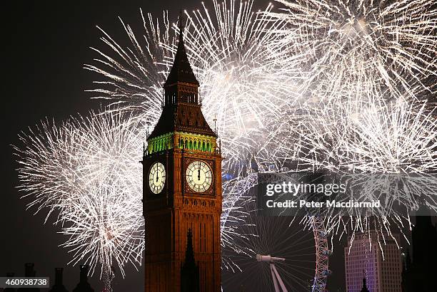 Fireworks light up the London skyline and Big Ben just after midnight on January 1, 2015 in London, England. For the first time thousands of people...