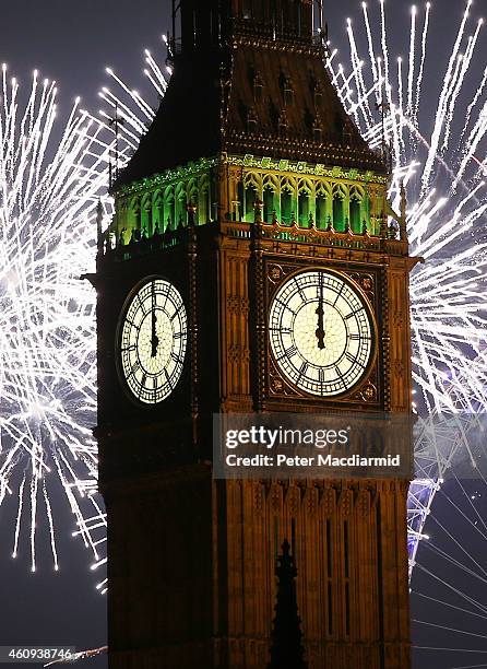 Fireworks light up the London skyline and Big Ben just after midnight on January 1, 2015 in London, England. For the first time thousands of people...