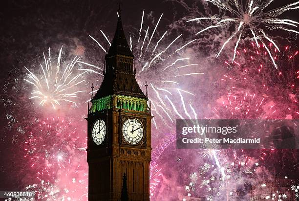 Fireworks light up the London skyline and Big Ben just after midnight on January 1, 2015 in London, England. For the first time thousands of people...