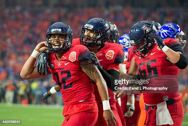 Quarterback Anu Solomon of the Arizona Wildcats celebrates his one yard touchdown run against the Boise State Broncos in the Vizio Fiesta Bowl at the...