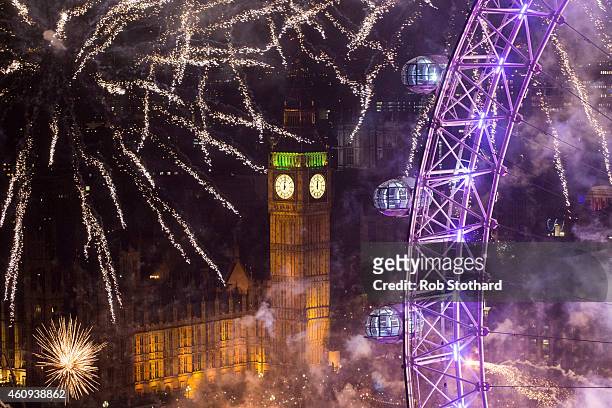 Fireworks light up the London skyline and Big Ben just after midnight on January 1, 2015 in London, England. Thousands of people lined the banks of...
