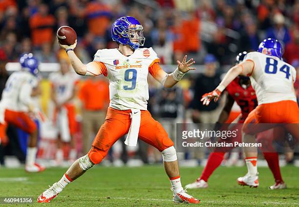 Quarterback Grant Hedrick of the Boise State Broncos throws a pass during the fourth quarter of the Vizio Fiesta Bowl against the Arizona Wildcats at...
