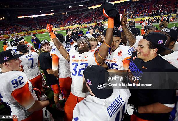 Boise State defensive end Rondell McNair celebrates with teammates after a 38-30 win against Arizona in the Vizio Fiesta Bowl at the University of...