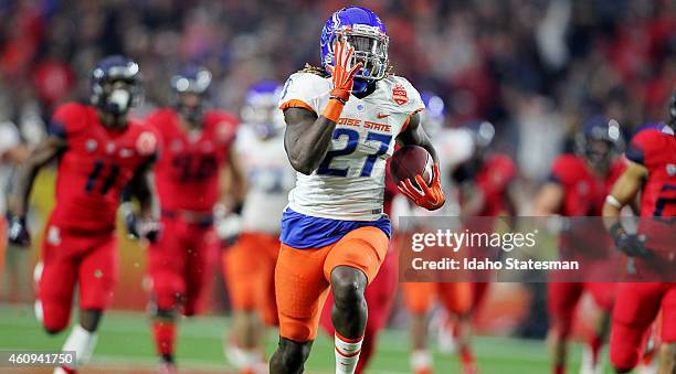 Boise State running back Jay Ajayi breaks loose for a 56-yard touchdown run during the first quarter against Arizona in the Vizio Fiesta Bowl at the...