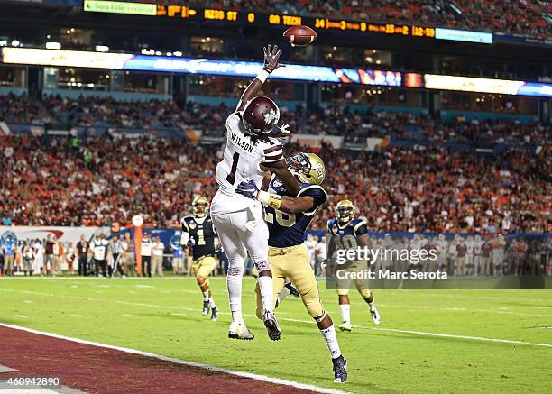 De'Runnya Wilson of the Mississippi State Bulldogs is defended by D.J. White of the Georgia Tech Yellow Jackets during the first half of the Capital...