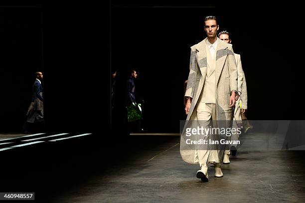 Models walk the runway finale at the MAN show during The London Collections: Men Autumn/Winter 2014 on January 6, 2014 in London, England.