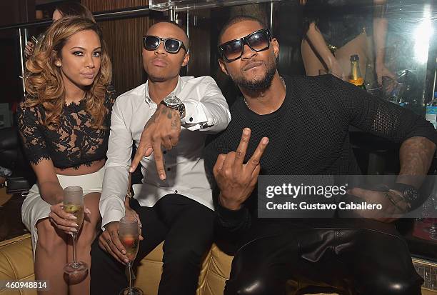 Erica Mena, Shad Moss and Usher attend E11EVEN Miami's NYE Celebration at E11EVEN on December 31, 2014 in Miami, Florida.