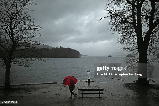 Visitors brave the wind and rain for a New Year's Day walk along the shores of Lake Windermere on January 1, 2015 in Windermere, England.