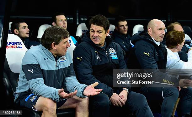 Newcastle United caretaker coach John Carver chats with coach Peter Beardsley as assistant Steve Stone looks on before the Barclays Premier League...