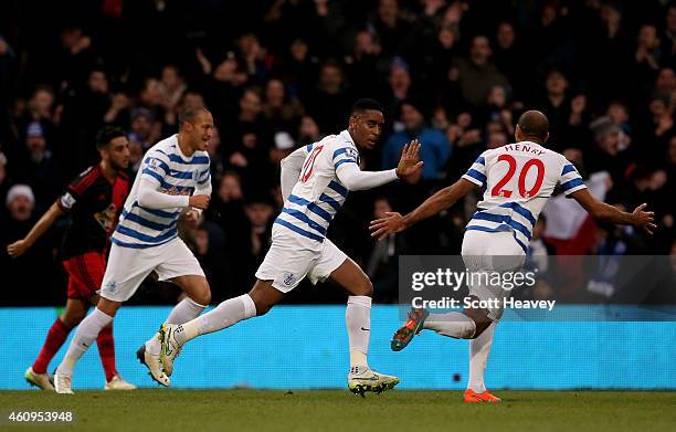 Leroy Fer of QPR celebrates with teammates after scoring the opening goal during the Barclays Premier League match between Queens Park Rangers and...