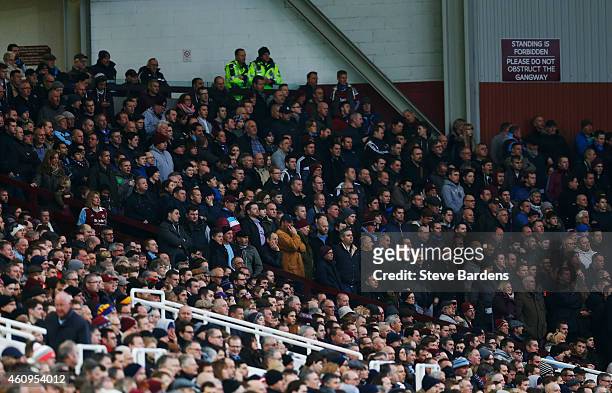 Fas watch the action during the Barclays Premier League match between West Ham United and West Bromwich Albion at Boleyn Ground on January 1, 2015 in...