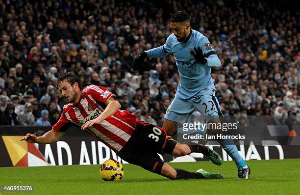 Gael Clichy of Manchester City brings down Will Buckley of Sundertland during the Barclays Premier League match between Manchester City and...