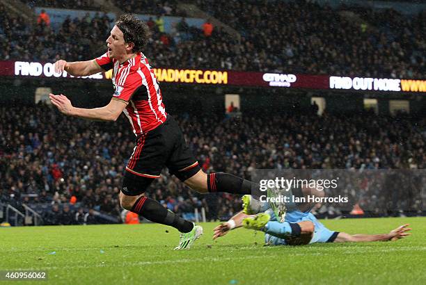 Will Buckley of Sunderland is brought down leading to the Sunderland penalty during the Barclays Premier League match between Manchester City and...