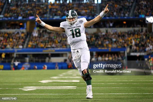 Connor Cook of the Michigan State Spartans celebrates after the Spartans score a touchdown against the Baylor Bears during the first half of the...