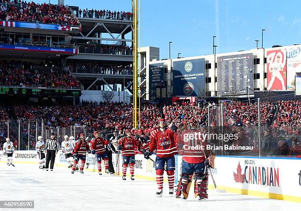 Eric Fehr and Braden Holtby of the Washington Capitals celebrate Fehr's first period goal against the Chicago Blackhawks during the 2015 Bridgestone...