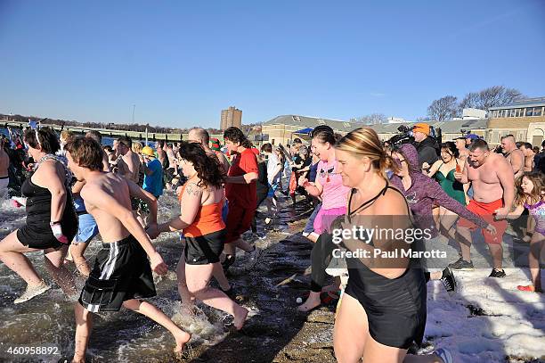 Several hundred swimmers brave the 24 degree Fahrenheit air temperature to participate in the L Street Brownies annual New Year's Day Boston Polar...