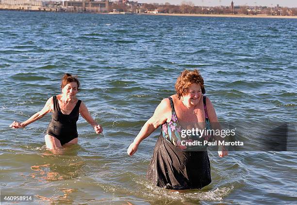 Several hundred swimmers brave the 24 degree Fahrenheit air temperature to participate in the L Street Brownies annual New Year's Day Boston Polar...