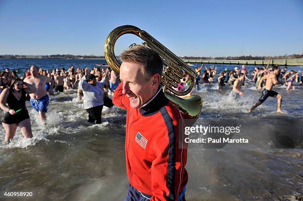 Several hundred swimmers brave the 24 degree Fahrenheit air temperature to participate in the L Street Brownies annual New Year's Day Boston Polar...