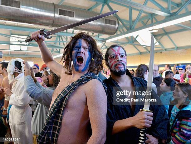 Several hundred swimmers brave the 24 degree Fahrenheit air temperature to participate in the L Street Brownies annual New Year's Day Boston Polar...