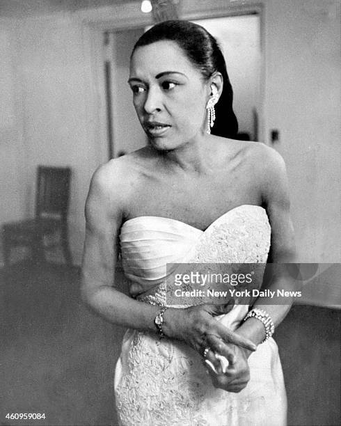 Billie Holiday backstage at Town Hall at her last major jazz concert before she became ill. Acknowledged to be one of the greatest jazz singers, Lady...