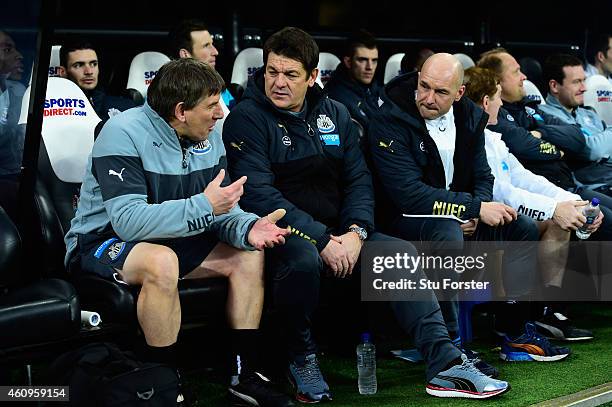 Newcastle United caretaker manager John Carver chats with coach Peter Beardsley as assistant Steve Stone looks on before the Barclays Premier League...