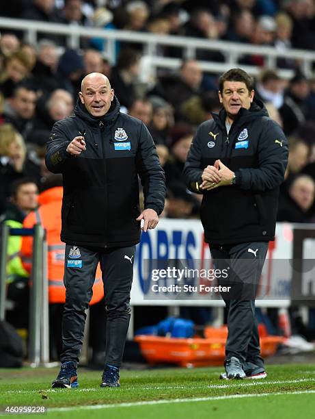 Newcastle United caretaker manager John Carver looks on as assistant Steve Stone barks out orders during the Barclays Premier League match between...
