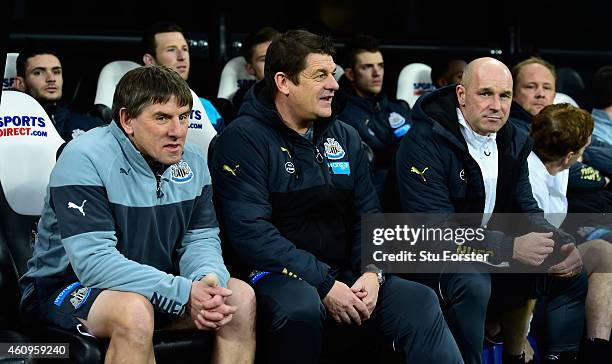 Newcastle United caretaker manager John Carver chats with coach Peter Beardsley as assistant Steve Stone looks on before the Barclays Premier League...