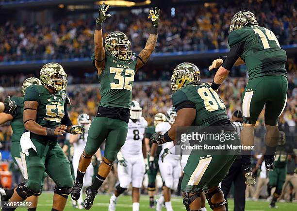 LaQuan McGowan of the Baylor Bears celebrates his touchdown against the Michigan State Spartans with Shock Linwood of the Baylor Bears and Bryce...