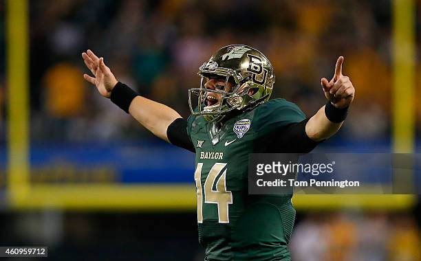 Bryce Petty of the Baylor Bears reacts after throwing a touchdown pass to LaQuan McGowan of the Baylor Bears against the Michigan State Spartans...
