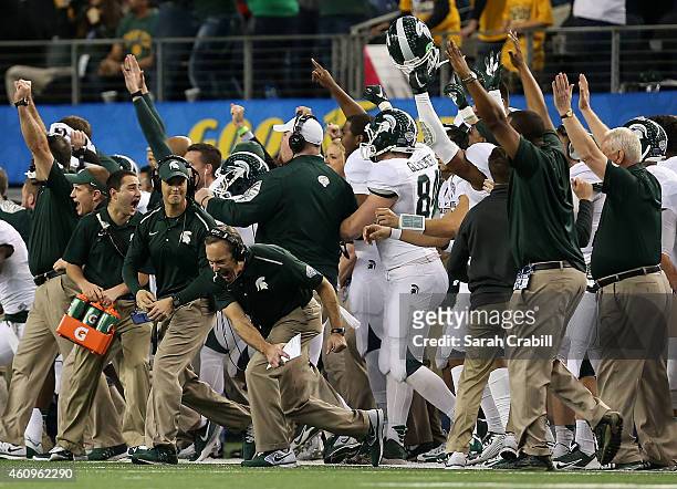 Michigan State Spartans head coach Mark Dantonio celebrates after the game winning extra point against the Baylor Bears during the second half of the...
