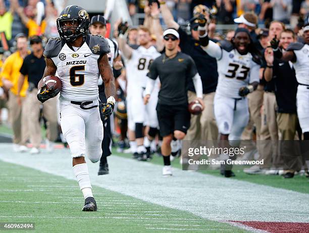 Marcus Murphy of the Missouri Tigers runs for yardage during the Buffalo Wild Wings Citrus Bowl against the Minnesota Golden Gophers at the Florida...