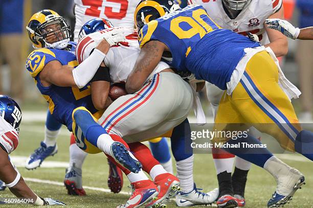 McDonald of the St. Louis Rams tackles against the New York Giants at the Edward Jones Dome on December 21, 2014 in St. Louis, Missouri.