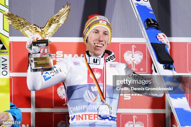 Thomas Diethart of Austria celebrates after winning the 62nd Four Hills Tournament at Paul-Auflerleitner-Schanze on January 6, 2014 in Bischofshofen,...