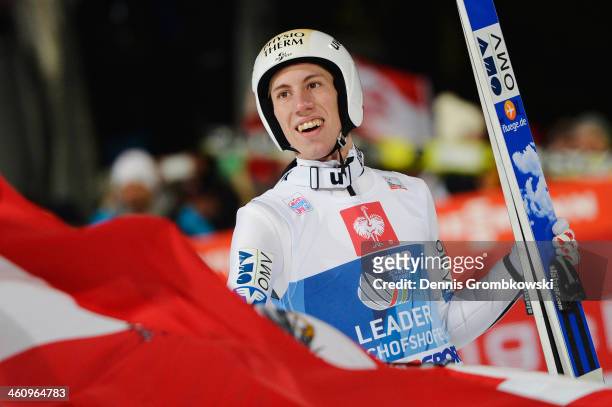 Thomas Diethart of Austria celebrates after winning the 62nd Four Hills Tournament at Paul-Auflerleitner-Schanze on January 6, 2014 in Bischofshofen,...
