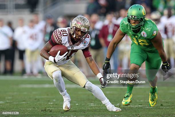 Wide receiver Rashad Greene of the Florida State Seminoles runs with the ball after a catch during the College Football Playoff Semifinal against the...