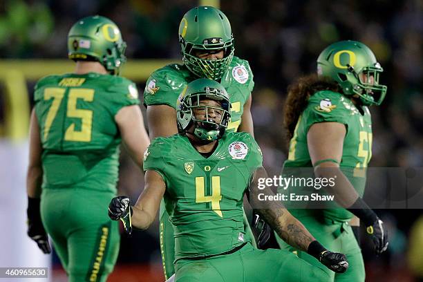 Defensive back Erick Dargan of the Oregon Ducks celebrates an interception against the Florida State Seminoles during the College Football Playoff...