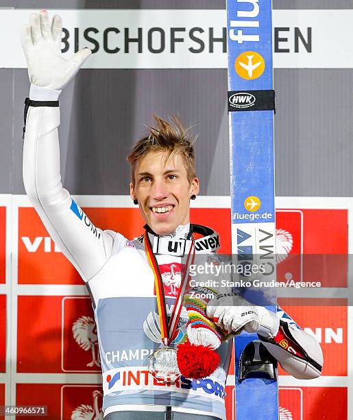 Thomas Diethart of Austria takes 1st place during the FIS Ski Jumping World Cup Vierschanzentournee on January 06, 2014 in Bischofhofen, Austria.